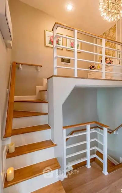 Elegant staircase with wooden steps and modern railing in a stylish home interior