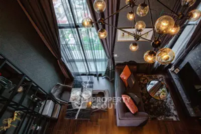 Luxurious high-rise living room with stunning city view and elegant chandelier