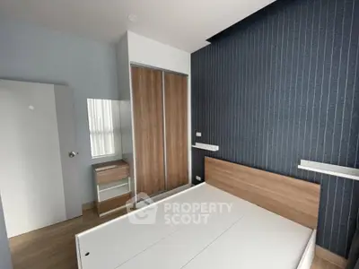 Modern bedroom with sleek wooden furniture and minimalist design