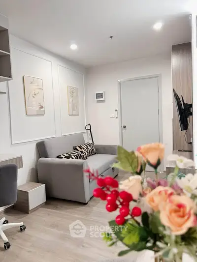Modern living room with stylish decor and cozy seating in a contemporary apartment.