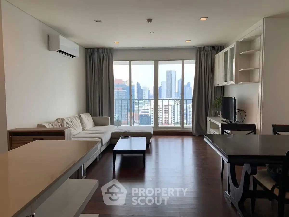 Spacious modern living room with city view and elegant furnishings
