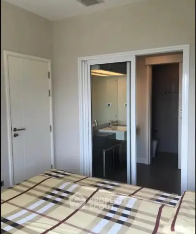 Modern bedroom with ensuite bathroom and stylish decor