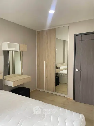 Modern bedroom with sleek wardrobe and minimalist design