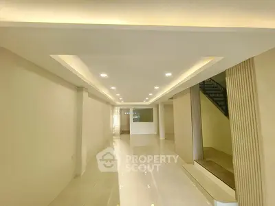 Spacious modern interior with sleek design and recessed lighting