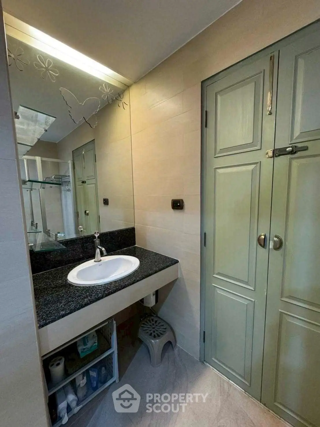 Modern bathroom with elegant sink and storage space