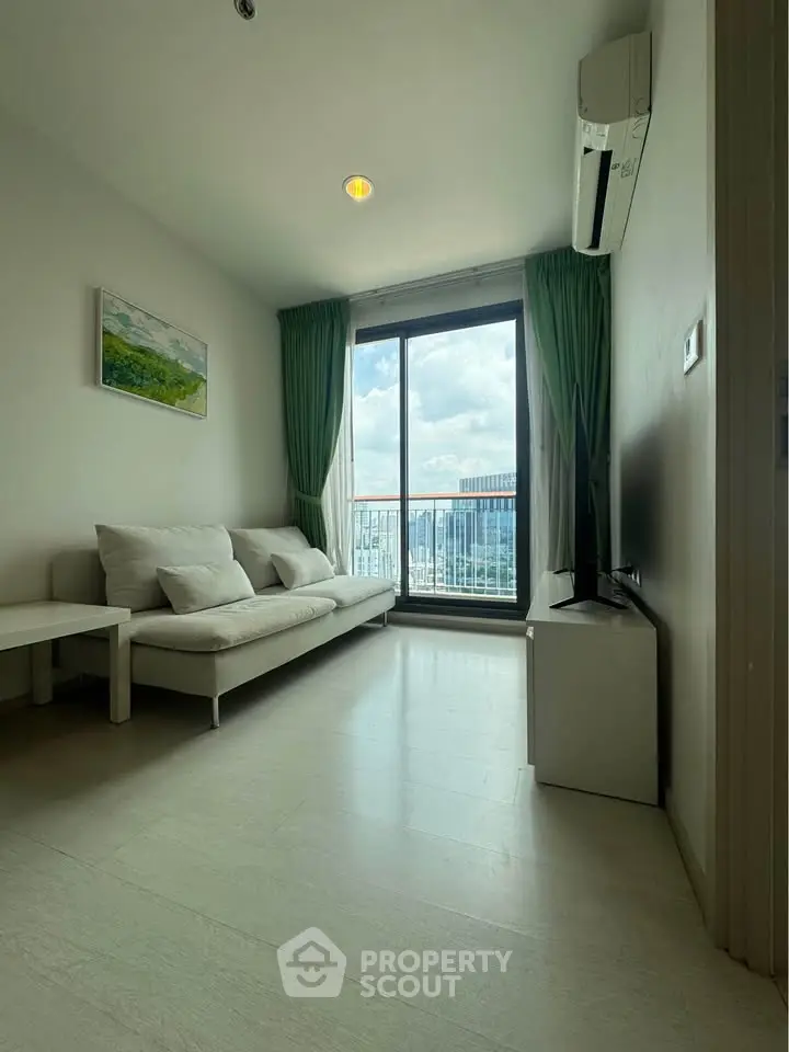 Modern living room with large window and city view, featuring a cozy sofa and air conditioning.