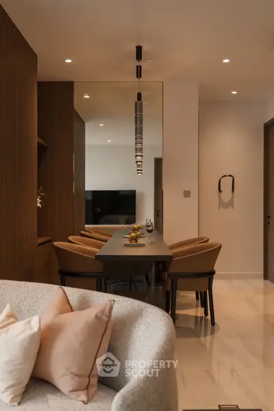 Elegant modern living room with stylish dining area and cozy seating, perfect for entertaining guests.