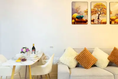 Modern living room with cozy sofa and elegant dining area