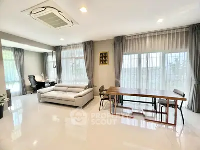 Spacious modern living room with elegant furniture and large windows