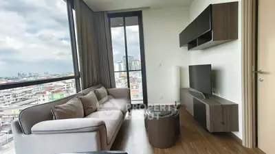 Modern living room with panoramic city view and stylish furniture
