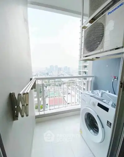 High-rise apartment balcony with washing machine and city view