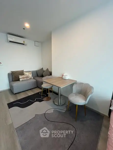 Modern living room with cozy gray sofa and stylish decor