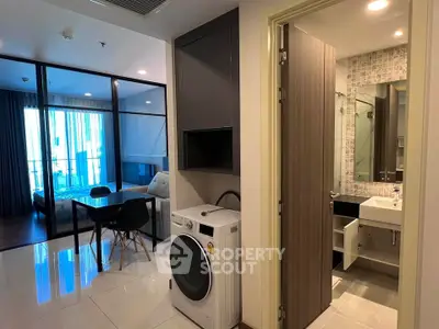 Modern apartment interior with washing machine and bathroom view