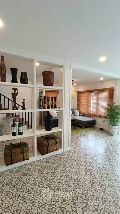 Stylish living room with decorative shelving and patterned tile flooring