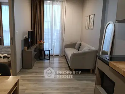 Modern living room with cozy sofa and stylish decor in a contemporary apartment.