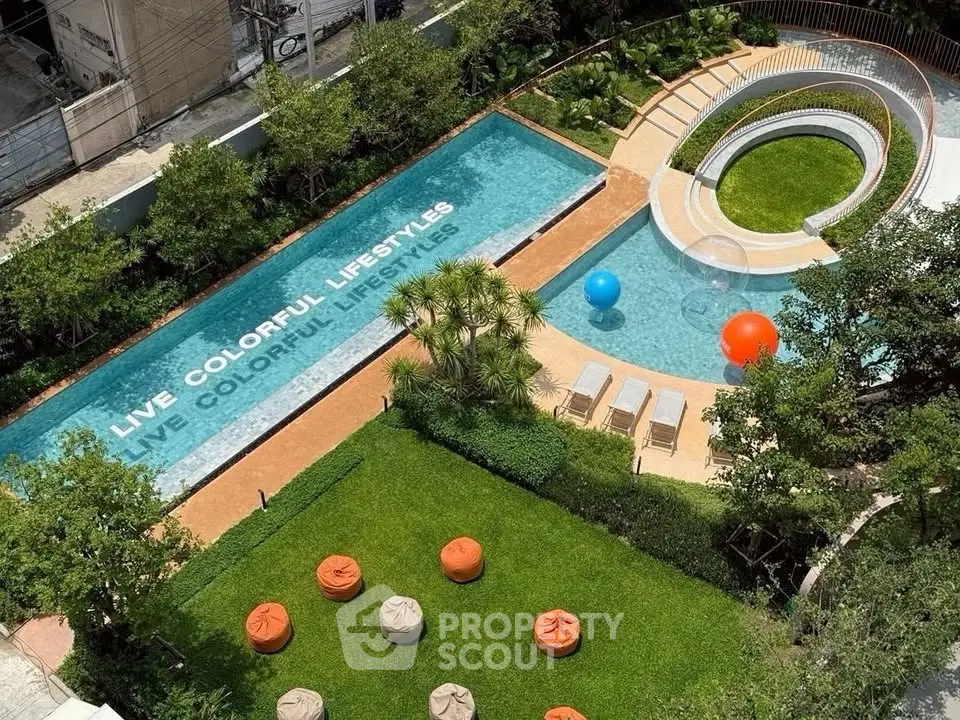 Luxurious outdoor pool area with vibrant garden and seating, perfect for colorful lifestyles.