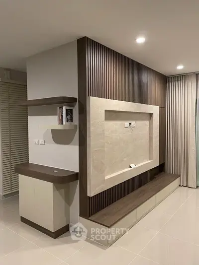 Modern living room with stylish wooden paneling and built-in shelving