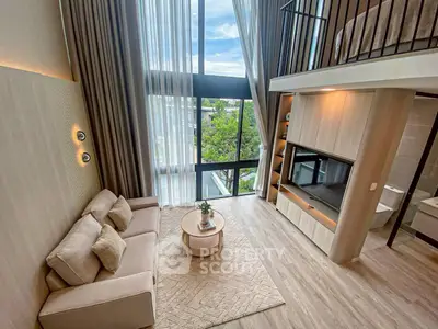 Luxurious loft-style living room with high ceilings and large windows offering stunning views.