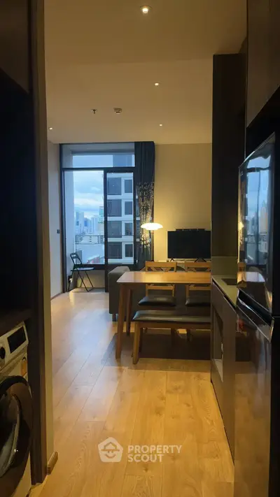 Modern open-plan living area with city view and stylish furnishings