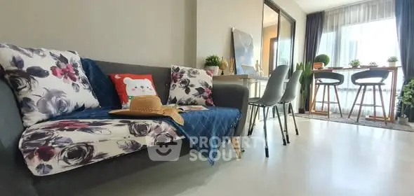 Modern living room with stylish decor and natural light, perfect for relaxation and entertaining.