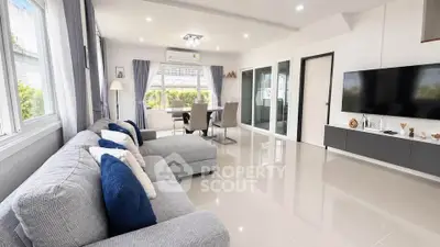 Spacious modern living room with sleek design and abundant natural light