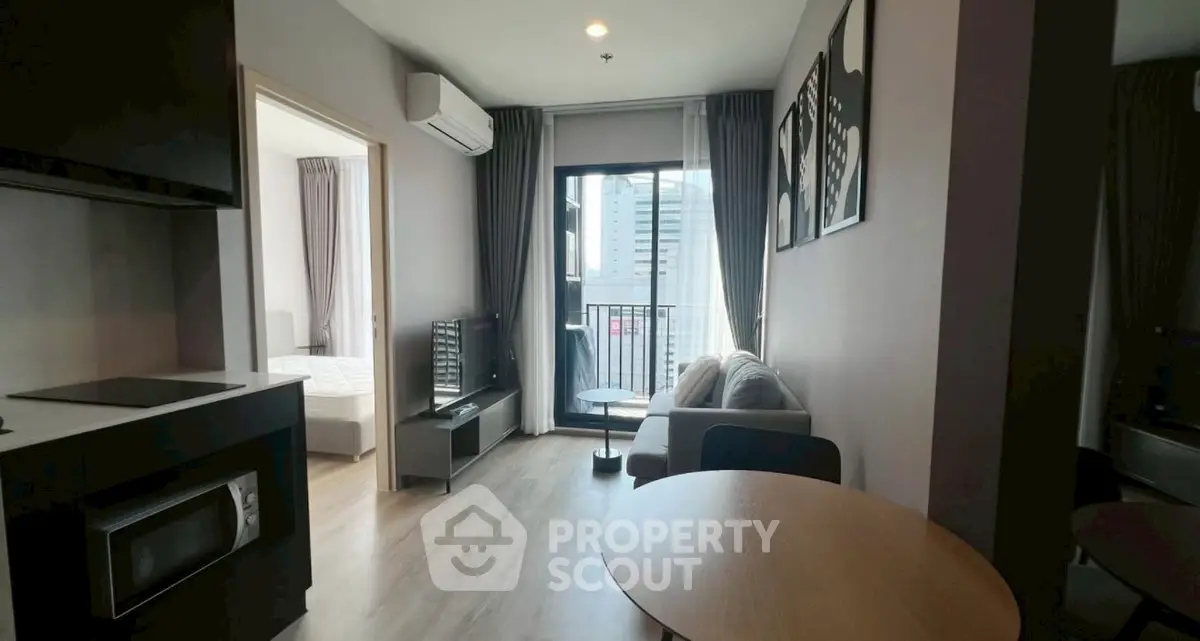 Modern apartment with open living room and balcony view