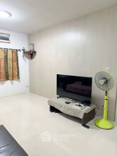 Cozy living room with modern TV setup and stylish decor