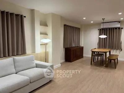 Spacious living room with modern furniture and elegant lighting