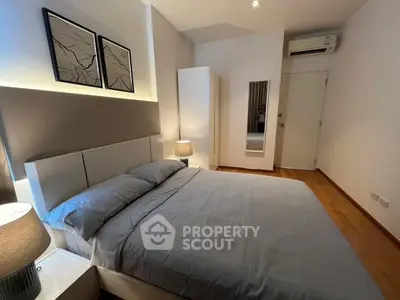 Modern bedroom with sleek design and ambient lighting