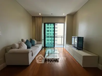 Modern living room with sleek furniture and balcony view in urban apartment