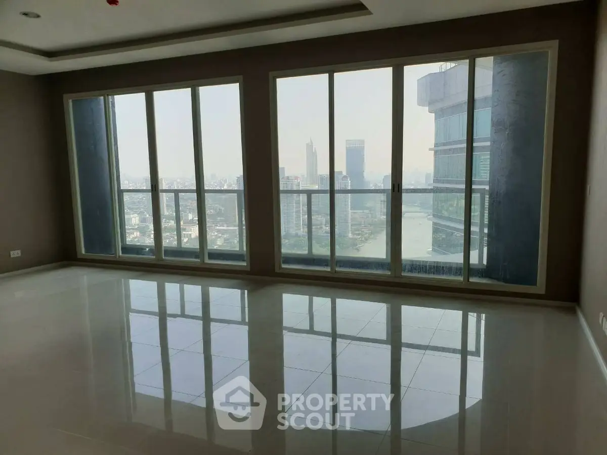 Spacious corner unit with floor-to-ceiling windows offering a stunning city view.
