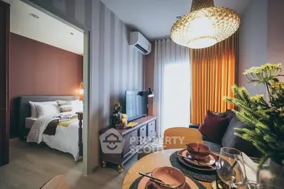 Chic modern living room with stylish decor and adjacent cozy bedroom