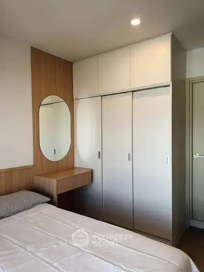 Modern bedroom with built-in wardrobe and stylish wooden accents