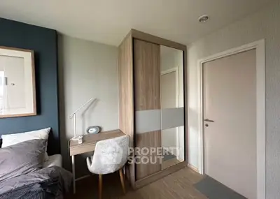 Modern bedroom with stylish wardrobe and cozy workspace