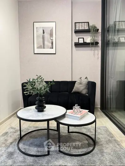 Chic modern living room with stylish black sofa and elegant decor