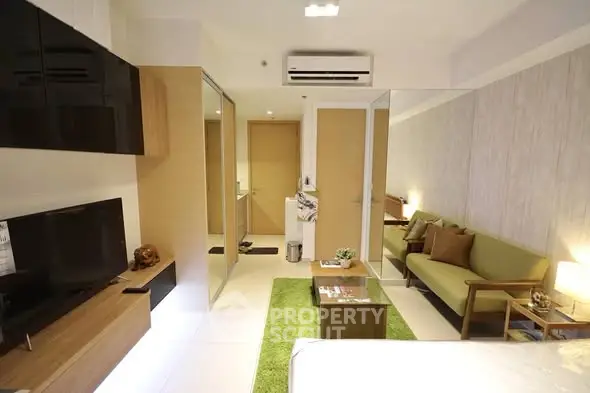 Modern living room with sleek design and cozy furniture in a stylish apartment.