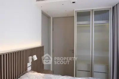 Modern bedroom with sleek closet and minimalist design