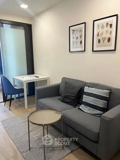 Modern living room with stylish sofa and artwork, perfect for cozy relaxation.