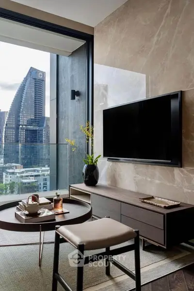 Modern living room with city view, sleek furniture, and wall-mounted TV in luxury apartment.