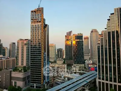 Stunning cityscape view showcasing modern high-rise buildings at sunset, perfect for urban living enthusiasts.
