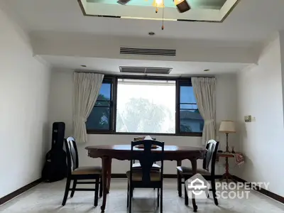 Elegant dining area with natural light and stylish furniture