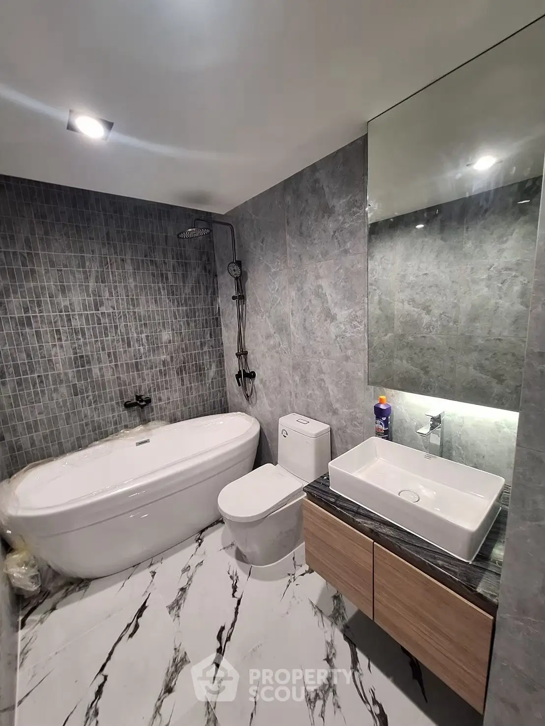 Luxurious modern bathroom with elegant marble flooring and sleek fixtures