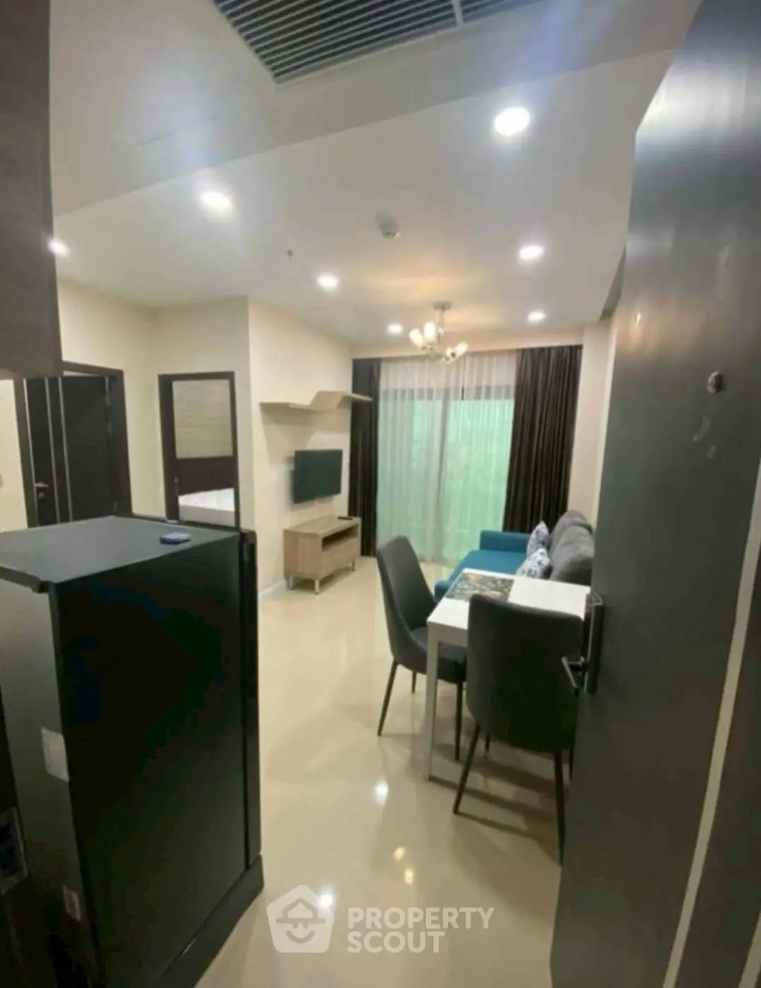 Modern living room with dining area and large window view