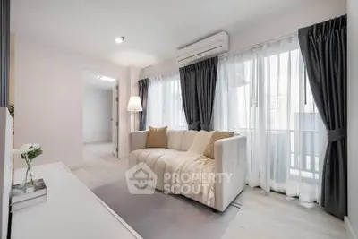 Bright and cozy living room with modern decor and large windows