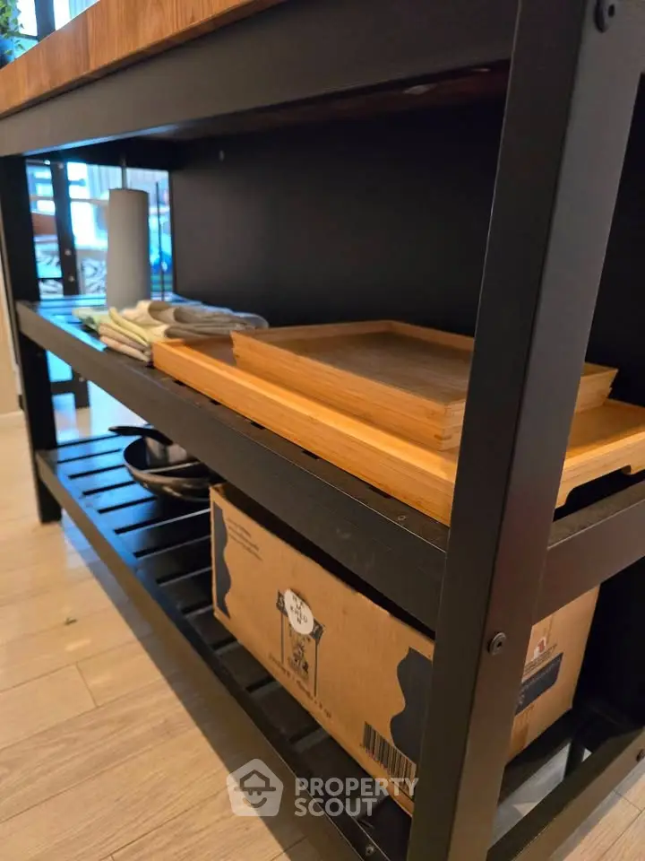 Modern kitchen storage shelf with wooden trays and boxes, ideal for organized living spaces.