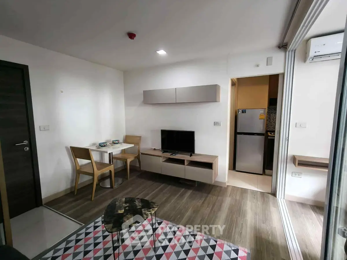 Modern living room with stylish furniture and open kitchen layout