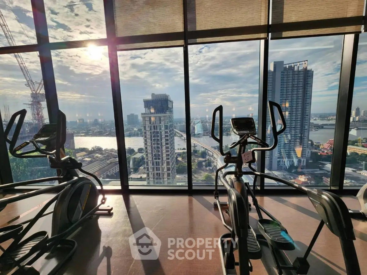 Luxury gym with panoramic city view and modern exercise equipment