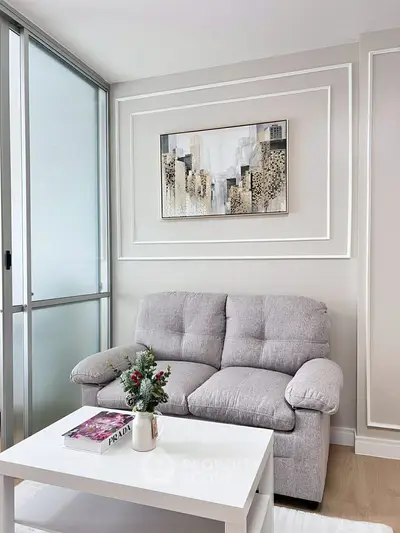 Cozy living room with modern decor and plush gray sofa