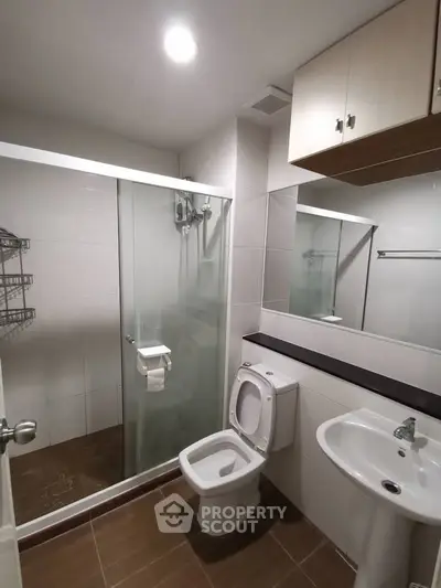 Modern bathroom with glass shower and sleek fixtures