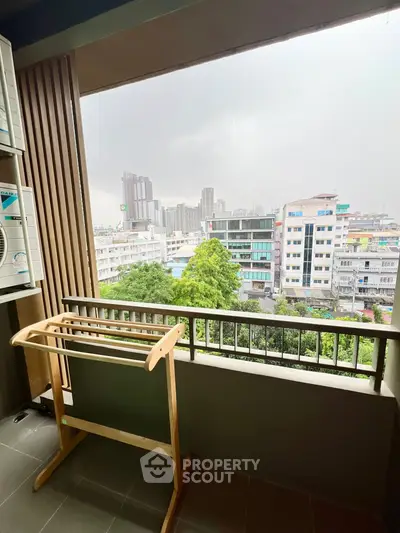 Spacious balcony with city view, perfect for relaxation and enjoying urban scenery.